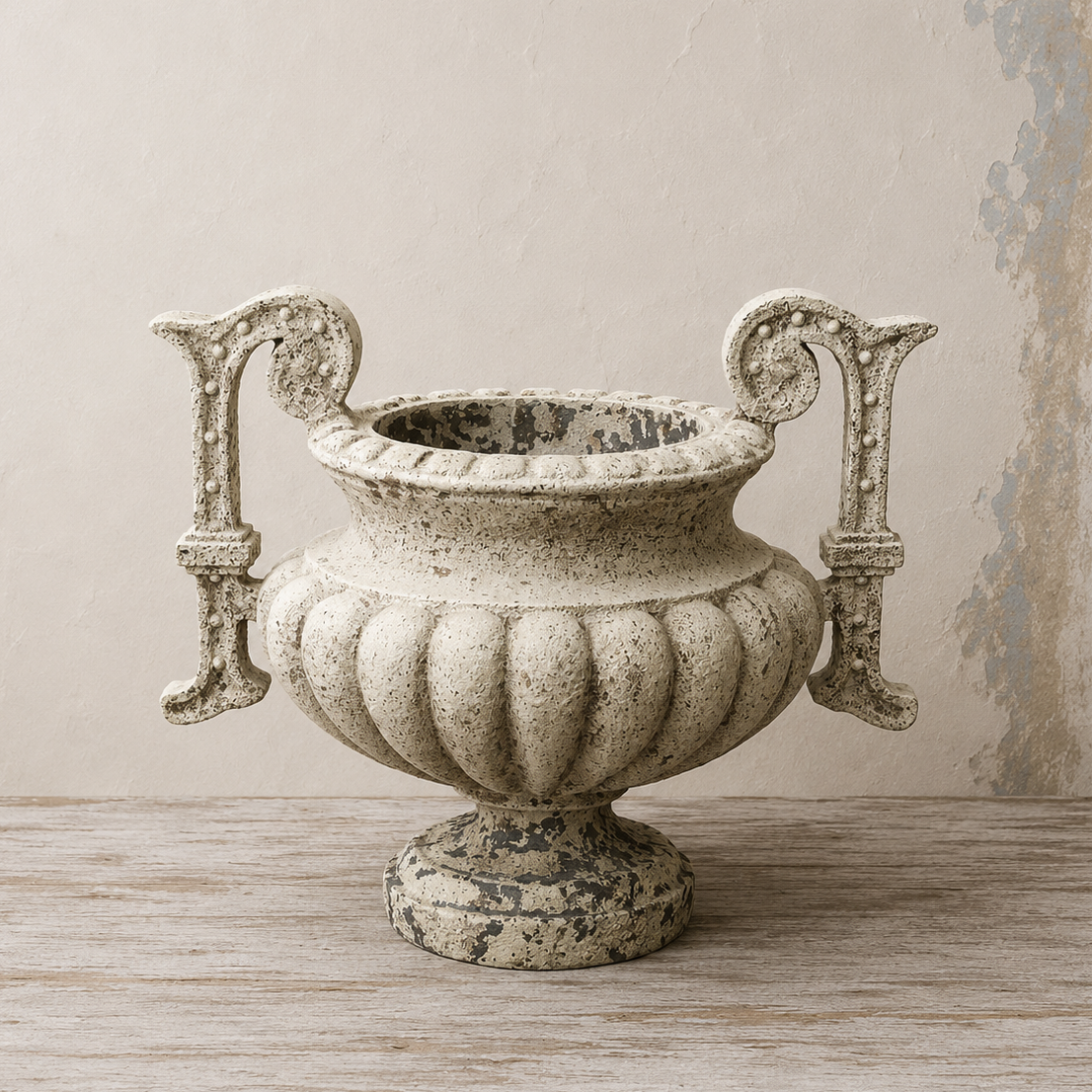 Large ornate handled planter with a distressed stone-effect finish, fluted body and pedestal base.