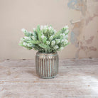Artificial Pine Cone Fern Flocked Stems with frosted green fern foliage, soft white flocked tips and pine cone detailing displayed in a textured metallic vase