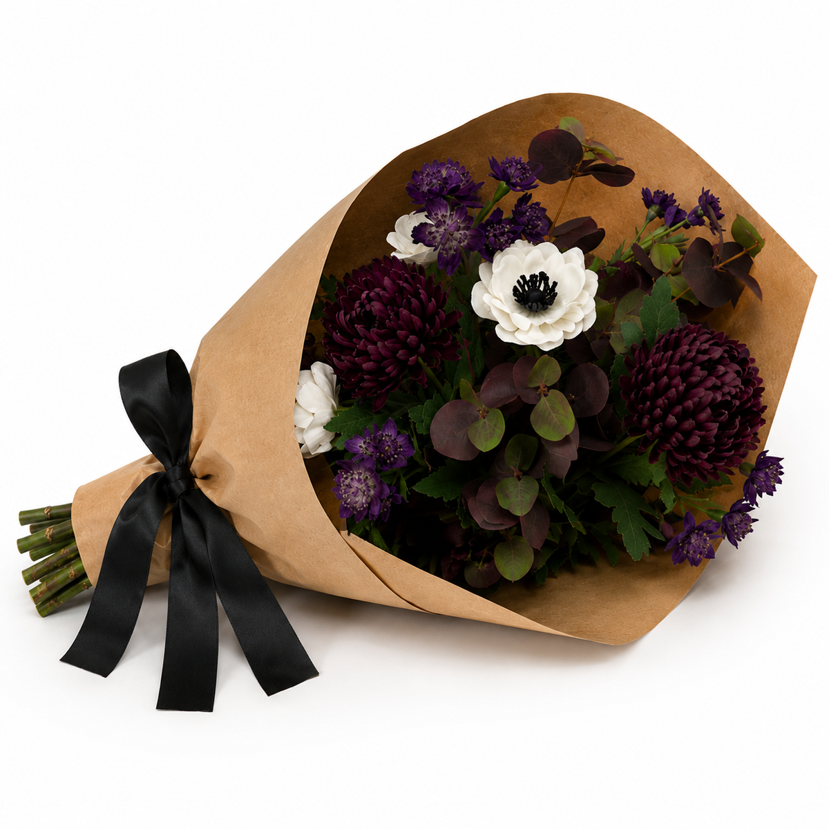 Artificial chrysanthemum, anemone and astrantia bouquet in rich purple and white tones, wrapped in brown kraft paper with a black satin ribbon.