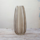Smoked Tall Ridged Glass Vase with vertical ribbed texture on wooden table.
