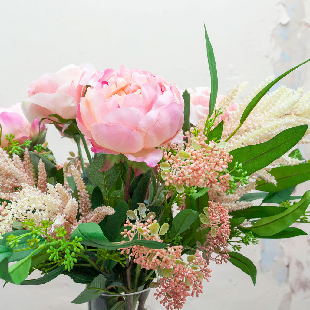 Peonies, roses, astilbe & eucalyptus set in our Christina vase.   Peony