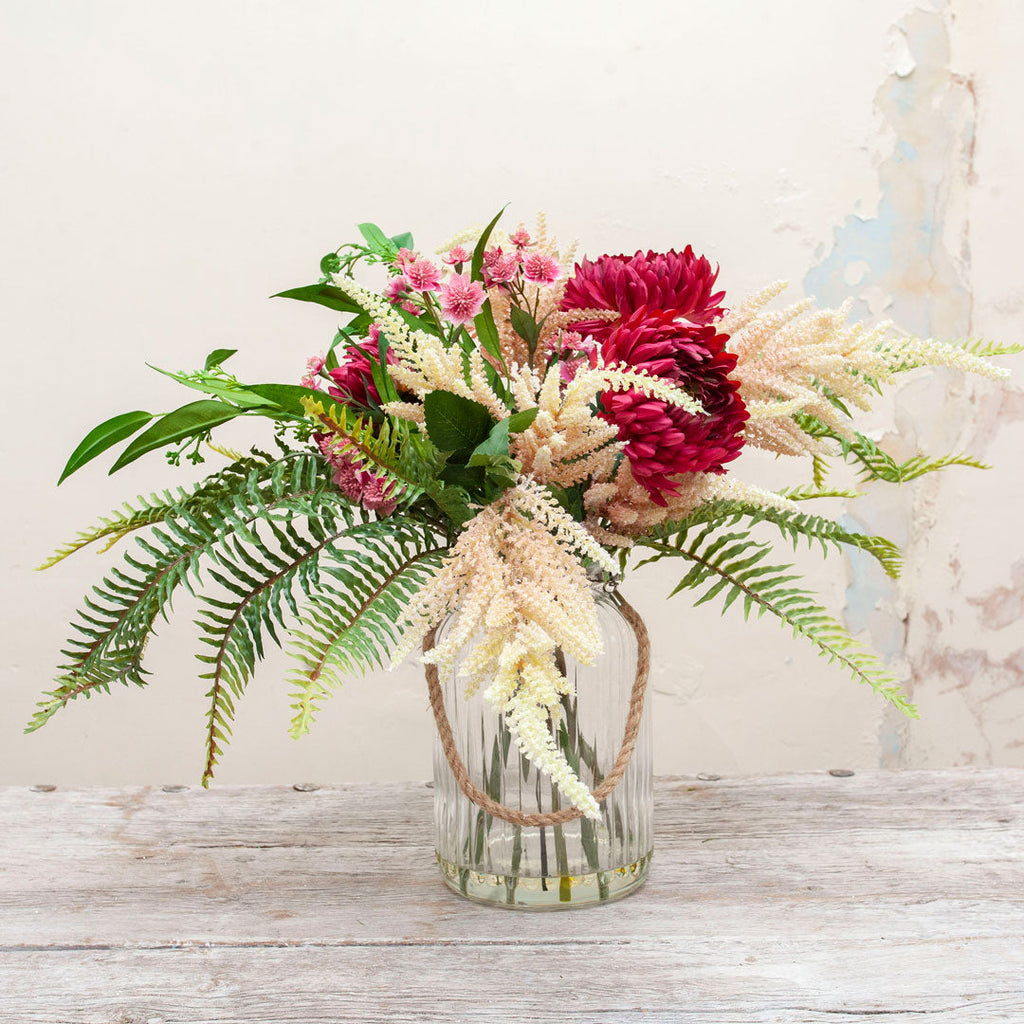 Chrysanthemums, Astrantia & Astilbe set with ferns in a rope lantern vase  Peony