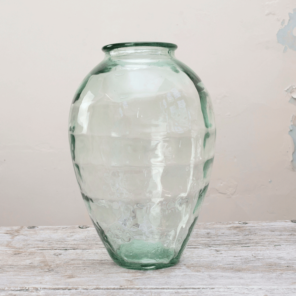 The large rounded glass vase with a lustre finish. Peony