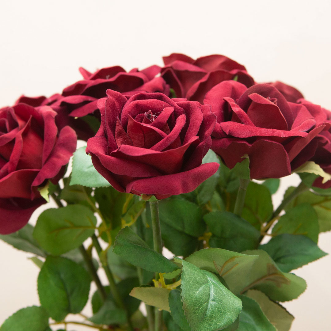 Close up of artificial red velvet rose stems