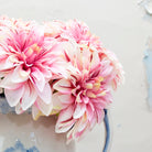 Artificial pink Dalia pick with fuchsia pink stripe.