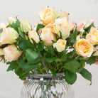 Faux peach rose stem with buds and leaves.