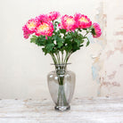 Vibrant fushia pink with yellow centre chrysanthemum. Peony