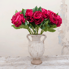 Dark fuchsia pink peony with leaves Peony