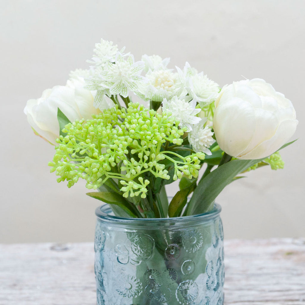 Tulips & Astrantia with Patrina set in a blue beaker textured vase Peony